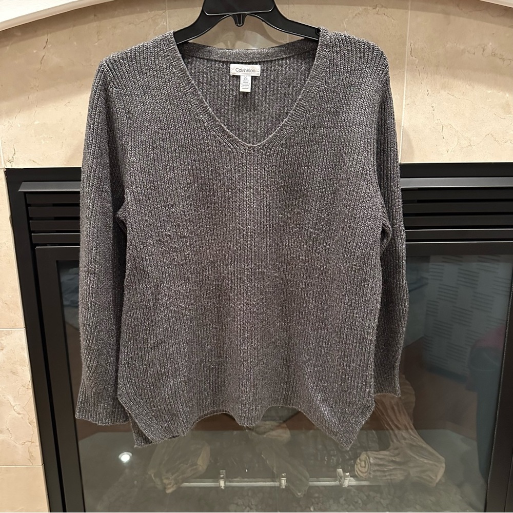 Calvin Klein Size L v neck sweater with slight bubble sleeve.